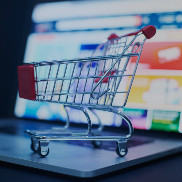 a small shopping cart on a laptop