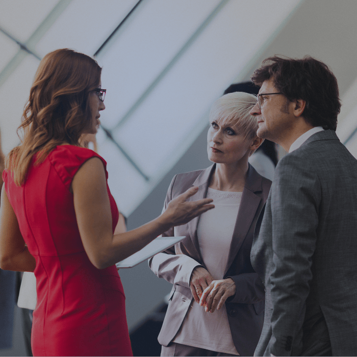 three people in business communicating